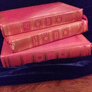 Set of three leather bound books.
